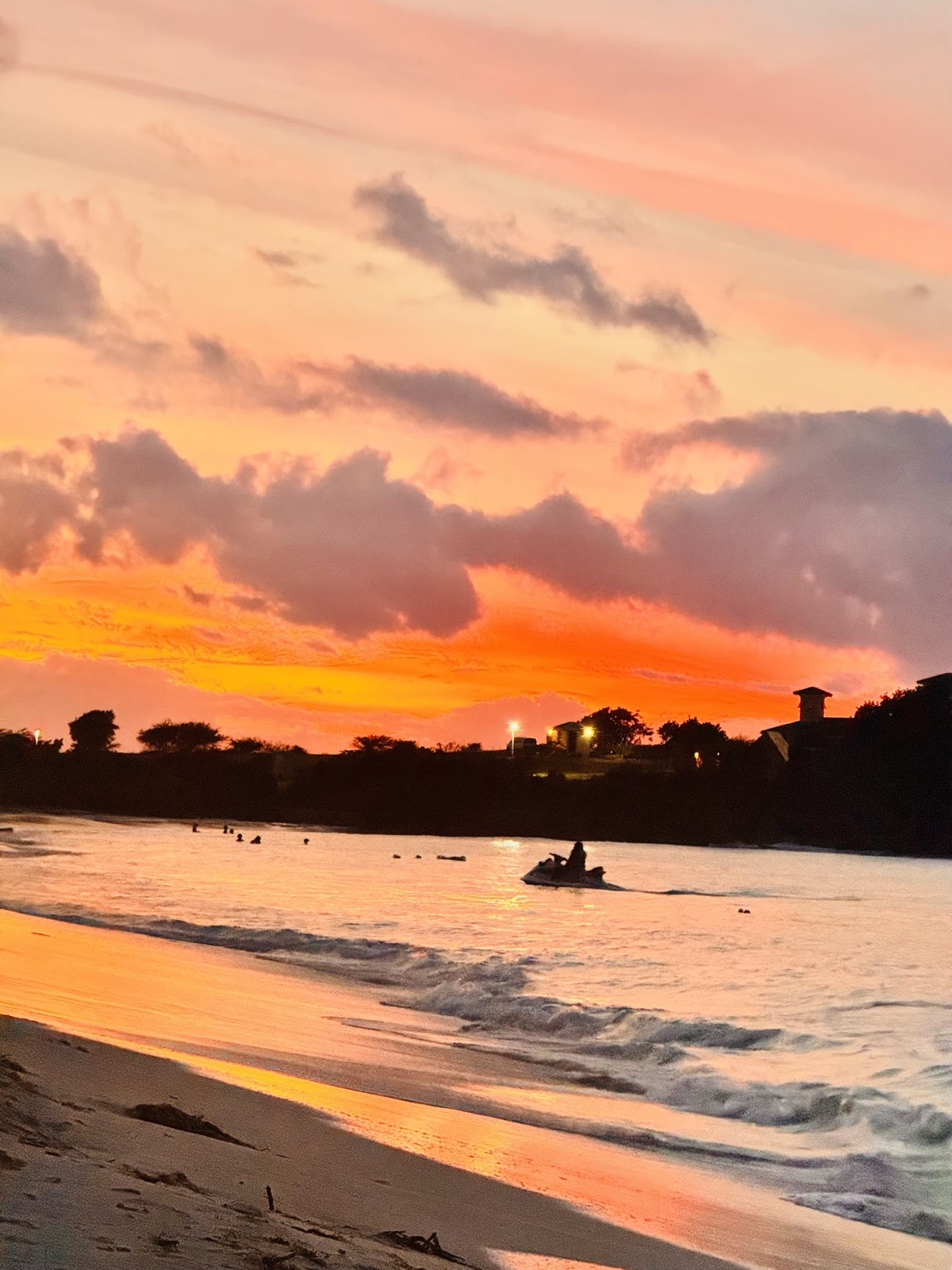 Golden-hour surf and sky over an Antiguan beach.